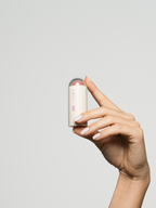 French Kiss Power Stick applied on cheeks - soft nude blush ÈME Beauty